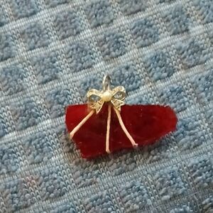 Source Unknown Red Rough Stone Pendant with Gold Bow Accent